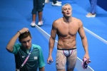 Italy's Nicolo Martinenghi reacts after winning the final of the men's 100m breaststroke swimming event during the Paris 2024 Olympic Games at the Paris La Defense Arena in Nanterre, west of Paris, on July 28, 2024. (Photo by Jonathan NACKSTRAND / AFP)